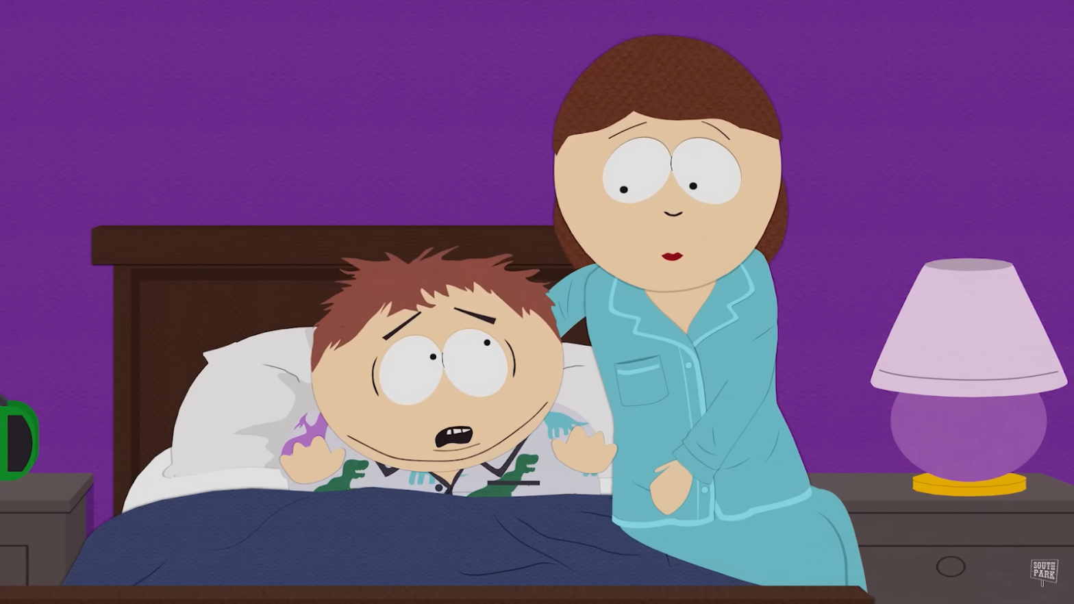 A cartoon child looks scared in bed, with a woman comforting him