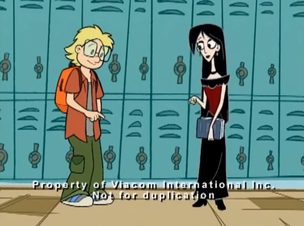Kyle in casual clothes and Rosemary in goth attire stand awkwardly in a school hallway